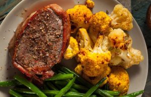 Delicious pork tenderloin in a bacon coat with a great side dish!