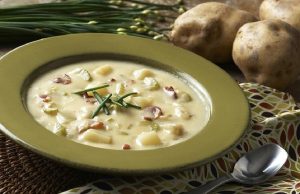 Rich and simple sour potato soup with wild mushrooms and bacon