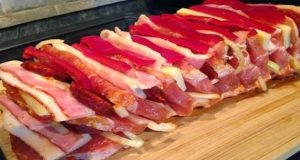 Roast meat prepared in marinade with crispy bacon, cheese and sausage