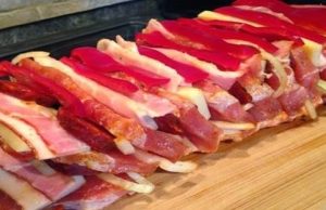 Roast meat prepared in marinade with crispy bacon, cheese and sausage