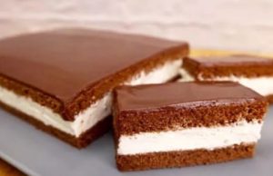 Delicate cocoa slices with creamy filling and fine chocolate icing
