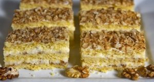 Delicious dessert with tasty cream and walnuts