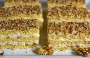 Delicious dessert with tasty cream and walnuts