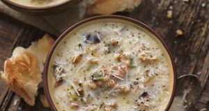Hearty potato and kale soup with sausage and parmesan cheese according to Italian recipe