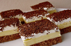 Delicious cake with vanilla pudding and cream
