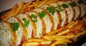 Juicy meat roll with cheese, sour cream and herbs