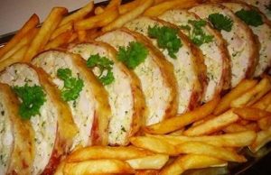 Juicy meat roll with cheese, sour cream and herbs