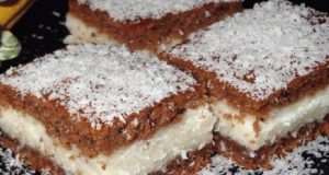 Fantastic cocoa slices with fluffy cream and sprinkled with coconut!