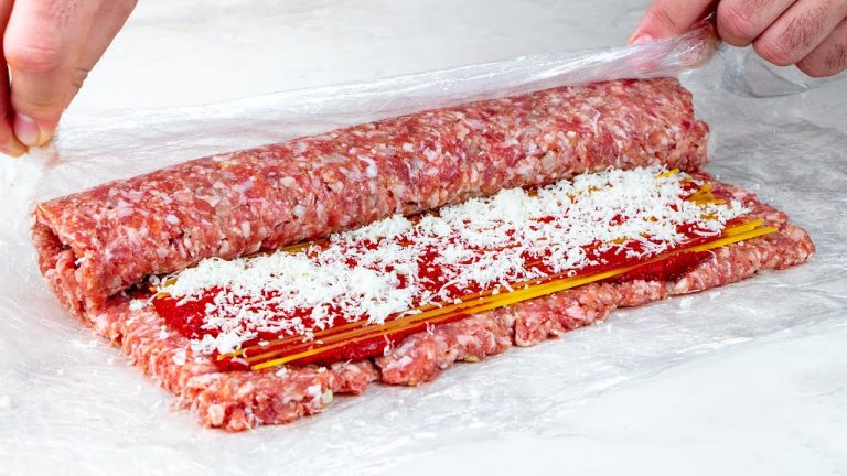 Delicious roulade of minced meat, tomato sauce and raw spaghetti
