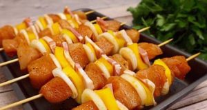 Roasted juicy chicken skewers with vegetables and bacon