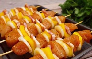 Roasted juicy chicken skewers with vegetables and bacon