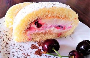A biscuit roll with cherries and a luxurious cream cheese filling!