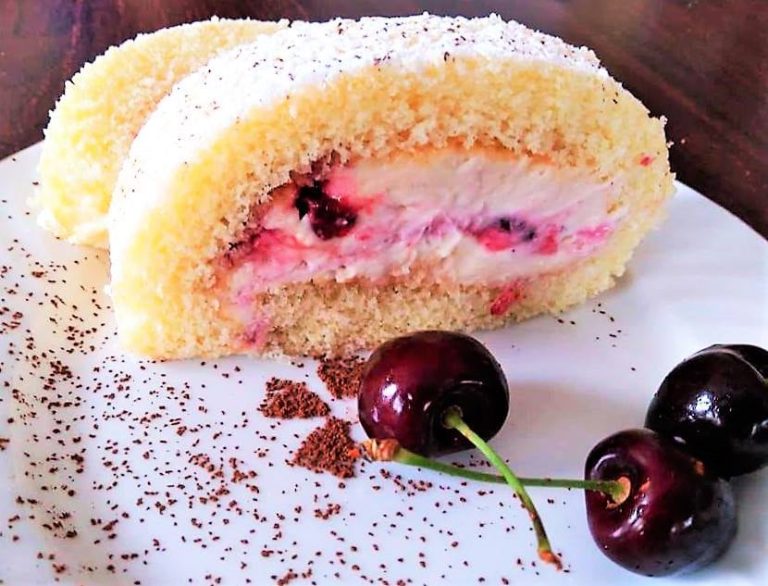 A biscuit roll with cherries and a luxurious cream cheese filling!