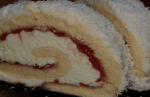 Delicious vanilla roll with jam and coconut