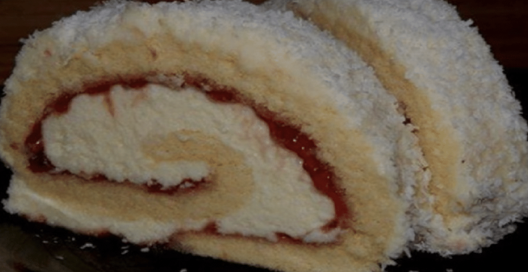 Delicious vanilla roll with jam and coconut