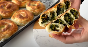 Salty crispy snails made from yeast dough with spinach and onion filling