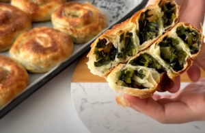 Salty crispy snails made from yeast dough with spinach and onion filling