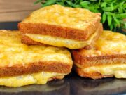 Baked Toasts from the Oven in an Egg Coat with Ham and Cheese Bread toasts filled with ham and cheese