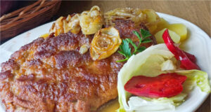 Juicy Upside-Down Pork Schnitzels Baked with Bacon and Onions Juicy upside-down pork schnitzels baked with bacon and onions