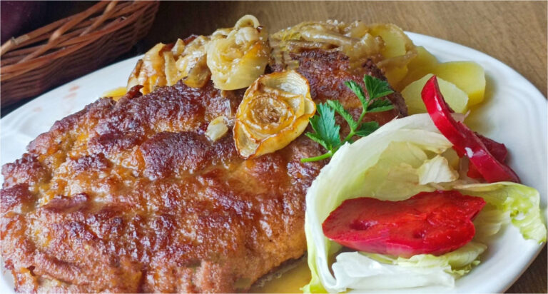 Juicy Upside-Down Pork Schnitzels Baked with Bacon and Onions