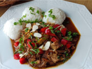 Lightning-fast One-pan Dinner: Juicy Spicy Turkey Stir-fry with Vegetables and Rice Juicy spicy turkey stir-fry with vegetables and rice served on a plate