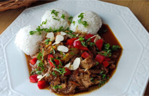 Lightning-fast One-pan Dinner: Juicy Spicy Turkey Stir-fry with Vegetables and Rice Juicy spicy turkey stir-fry with vegetables and rice served on a plate