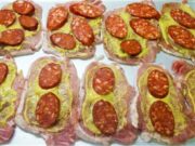 Pork Cutlets “Under a Blanket”: Juicy Meat with Smoked Cheese and Sausage Pork loin baked with cream, cheese, and sausage: Juicy cutlets without breading