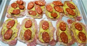 Pork Cutlets “Under a Blanket”: Juicy Meat with Smoked Cheese and Sausage Pork loin baked with cream, cheese, and sausage: Juicy cutlets without breading