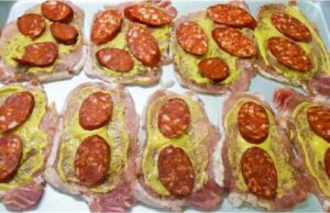 Pork Cutlets “Under a Blanket”: Juicy Meat with Smoked Cheese and Sausage Pork loin baked with cream, cheese, and sausage: Juicy cutlets without breading