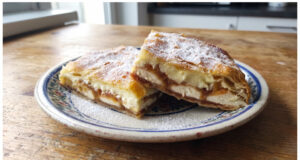 Apple and Custard Puff Pastry Slices: Moist Dessert with Simple Layering Apple and custard puff pastry slices on a tray