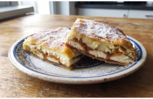 Apple and Custard Puff Pastry Slices: Moist Dessert with Simple Layering Apple and custard puff pastry slices on a tray