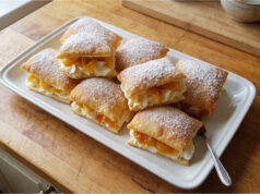 Apple Puff Pastries: Crispy Dessert with Delicate Mascarpone Cream Apple puff pastries with mascarpone cream on a plate
