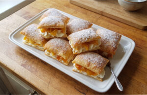 Apple Puff Pastries: Crispy Dessert with Delicate Mascarpone Cream Apple puff pastries with mascarpone cream on a plate