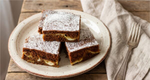 Black Cake with Quark and Lotus Biscuits: Moist Dessert Without Lengthy Beating Black cake with quark and Lotus biscuits on a tray