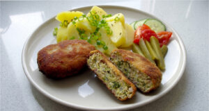 Cabbage Patties with Mashed Potatoes: Golden Coating and Juicy Filling with Smoked Pork Belly Cabbage patties with golden coating served with mashed potatoes