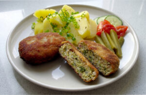 Cabbage Patties with Mashed Potatoes: Golden Coating and Juicy Filling with Smoked Pork Belly Cabbage patties with golden coating served with mashed potatoes