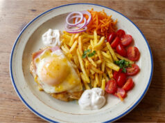 Chicken Breast with Ham, Cheese and Peach: A Retro Lunch with Fries Chicken breast with ham, cheese and peach served with fries