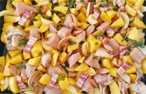 Chicken with Potatoes, Bacon and Vegetables on One Tray: Just Mix Everything and Bake Chicken with potatoes, bacon and vegetables on a baking tray