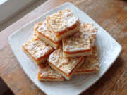 Crumb Cake with Vanilla Pudding and Apricots: Moist Dessert with a Crunchy Layer Crumb cake with vanilla pudding and apricots on a tray