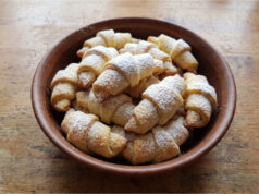Delicate Filled Crescents: Soft Dough and Rich Walnut Filling Delicate filled crescents on a plate