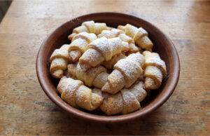 Delicate Filled Crescents: Soft Dough and Rich Walnut Filling Delicate filled crescents on a plate