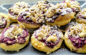 Delicate Yeast Pastries for Afternoon Coffee: With Blackberry Quark, Rum Raisins, Crumble and Almonds Delicate yeast pastries with blackberry quark and rum raisins