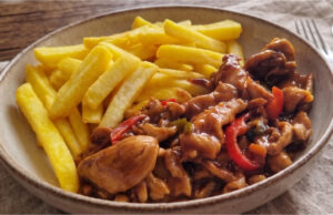 Chicken Stir-Fry with Vegetables and Fries: Juicy Dinner with Asian Sauces Delicious chicken stir-fry with vegetables and homemade fries