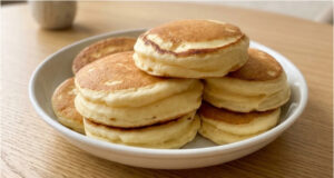 Recipe for Extra Fluffy Japanese Pancakes: Tall, Soft and Light as a Cloud Extra fluffy Japanese pancakes stacked on a plate with syrup and fruit