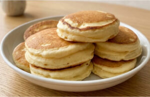 Recipe for Extra Fluffy Japanese Pancakes: Tall, Soft and Light as a Cloud Extra fluffy Japanese pancakes stacked on a plate with syrup and fruit