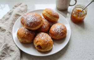 Fluffy Homemade Doughnuts with Jam: Soft Dough and Golden Surface Without Excess Oil Fluffy homemade doughnuts with jam on a plate