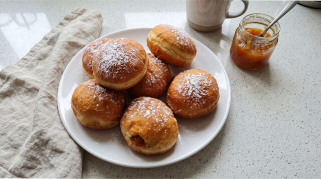 fluffy-homemade-doughnuts-jam Fluffy homemade doughnuts with jam on a plate