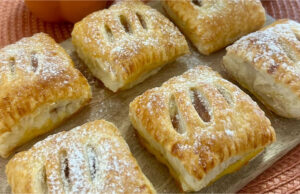 Fluffy Puff Pastries Filled with Vanilla Pudding and Strawberry Gel Fluffy puff pastries filled with vanilla pudding and strawberry gel