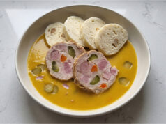 Hamburg Pork with Bread Dumplings: Traditional Sunday Lunch with Creamy Vegetable Sauce Hamburg pork with bread dumplings and creamy vegetable sauce served on a plate