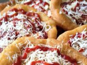 Homemade Langos from Yogurt Dough: Rise Overnight in the Fridge and Fluffy the Next Day Homemade langos from yogurt dough on a plate, topped with cheese and ketchup